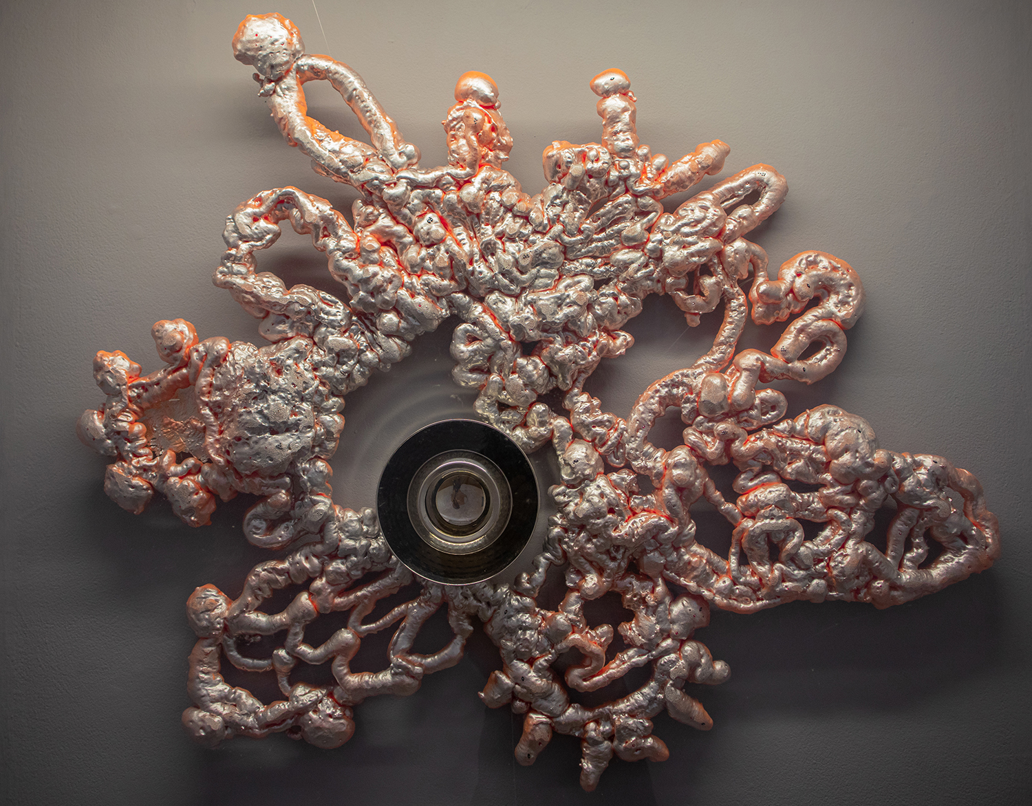 “ALL-SEEING WORK, FOREVER WORK” BY KAMIKA PETERS through the labour arts catalyst program. Featuring a pink and silver reflective organically shaped sculpture with a mirror in the middle.