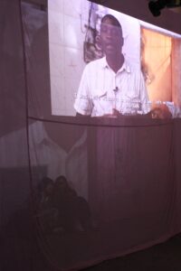 Rendition video projected on pink fabric