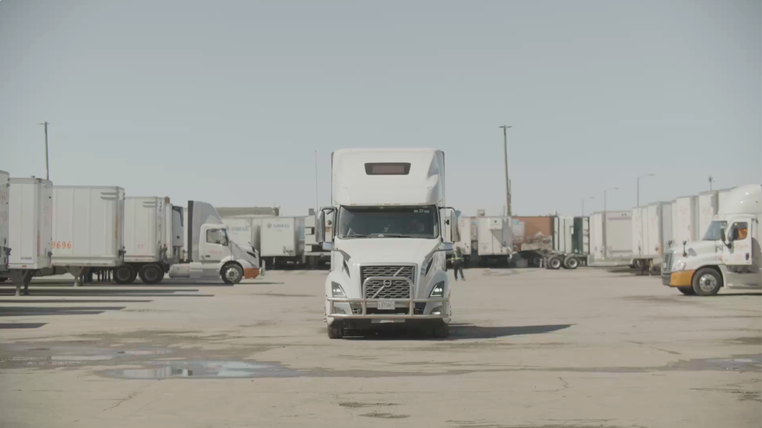 A transport truck in a truckyard. Screengrab from the film Landlines.